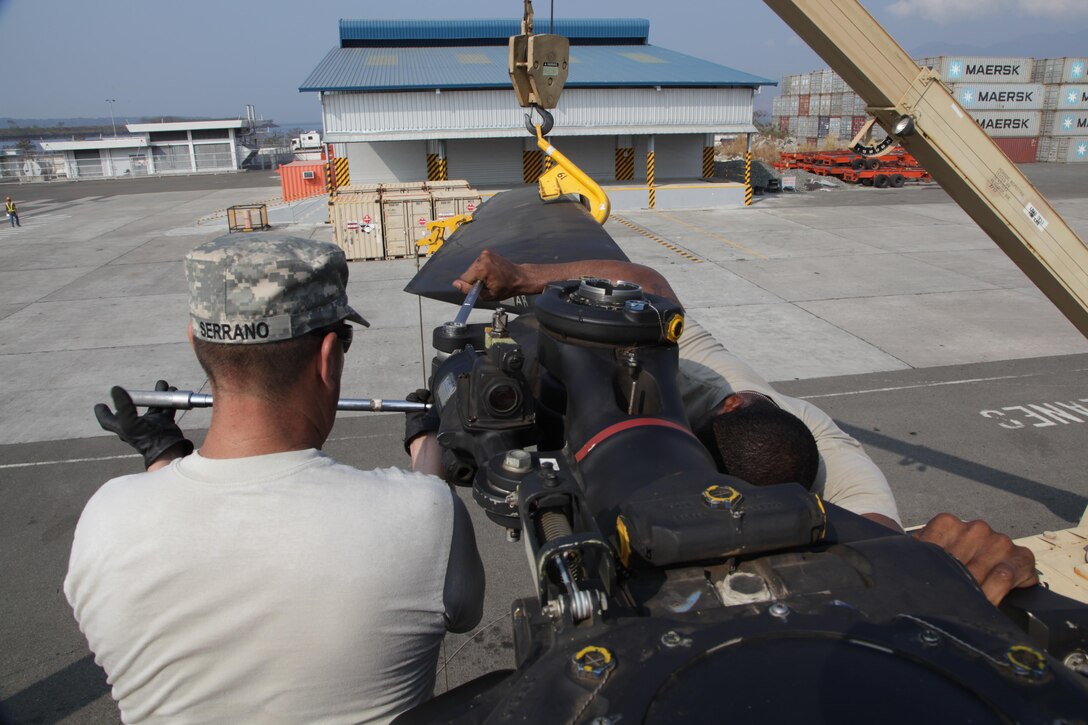 U.S. Army Staff Sgt. Gilbert Serrano uses a torque wrench to tighten the rotor blade of a CH-47 Chinook helicopter during port operations for Balikatan 2017 in Subic Bay, Zambales, May 2, 2017. Balikatan is an annual U.S.-Philippine bilateral military exercise focused on a variety of missions, including humanitarian assistance and disaster relief, counterterrorism and other combined military operations. 