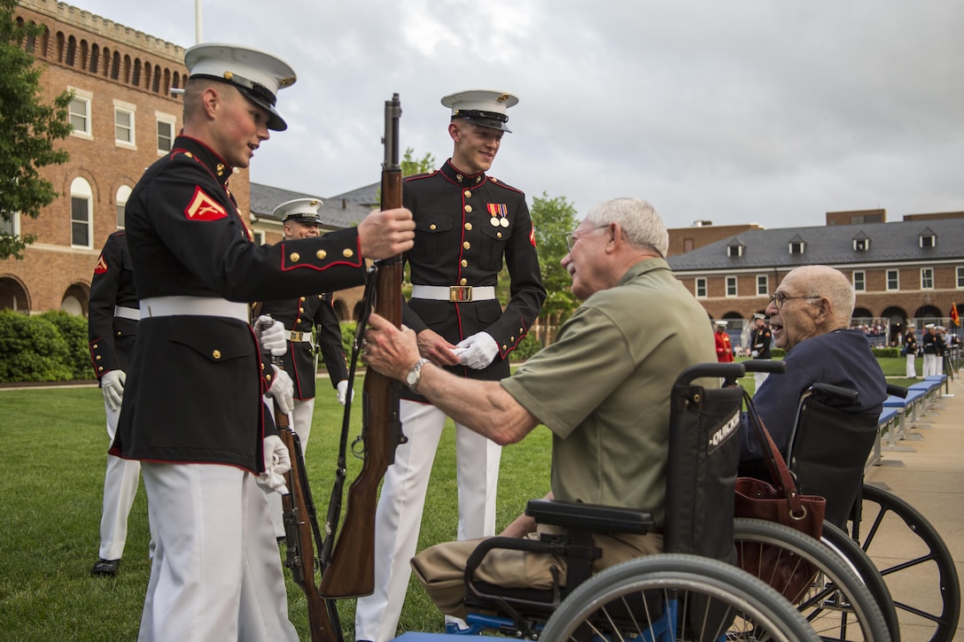 Crowd educators with Marine Barracks Washington D.C. interact with guests during a Friday Evening Parade at Marine Barracks Washington D.C., May 5, 2017. The guests of honor for the parade were the Honorable Paul Cook, California’s 8th Congressional District Congressman, the Honorable Jack Bergman, Michigan’s 1st Congressional District Congressman, and the Honorable Salud Carbajal, California’s 24th Congressional District Congressman. The hosting official was Gen. Glenn Walters, assistant commandant of the Marine Corps. (Official Marine Corps photo by Cpl. Robert Knapp/Released)