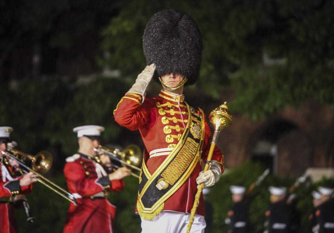 Master Sgt. Duane King, drum major, “The President’s Own”U.S. Marine Corps Band, salutes the hosting official and guests of honor during a Friday Evening Parade at Marine Barracks Washington D.C., May 5, 2017. The guests of honor for the parade were the Honorable Paul Cook, California’s 8th Congressional District Congressman, the Honorable Jack Bergman, Michigan’s 1st Congressional District Congressman, and the Honorable Salud Carbajal, California’s 24th Congressional District Congressman. The hosting official was Gen. Glenn Walters, assistant commandant of the Marine Corps.(Official Marine Corps photo by Lance Cpl. Damon Mclean/Released)
