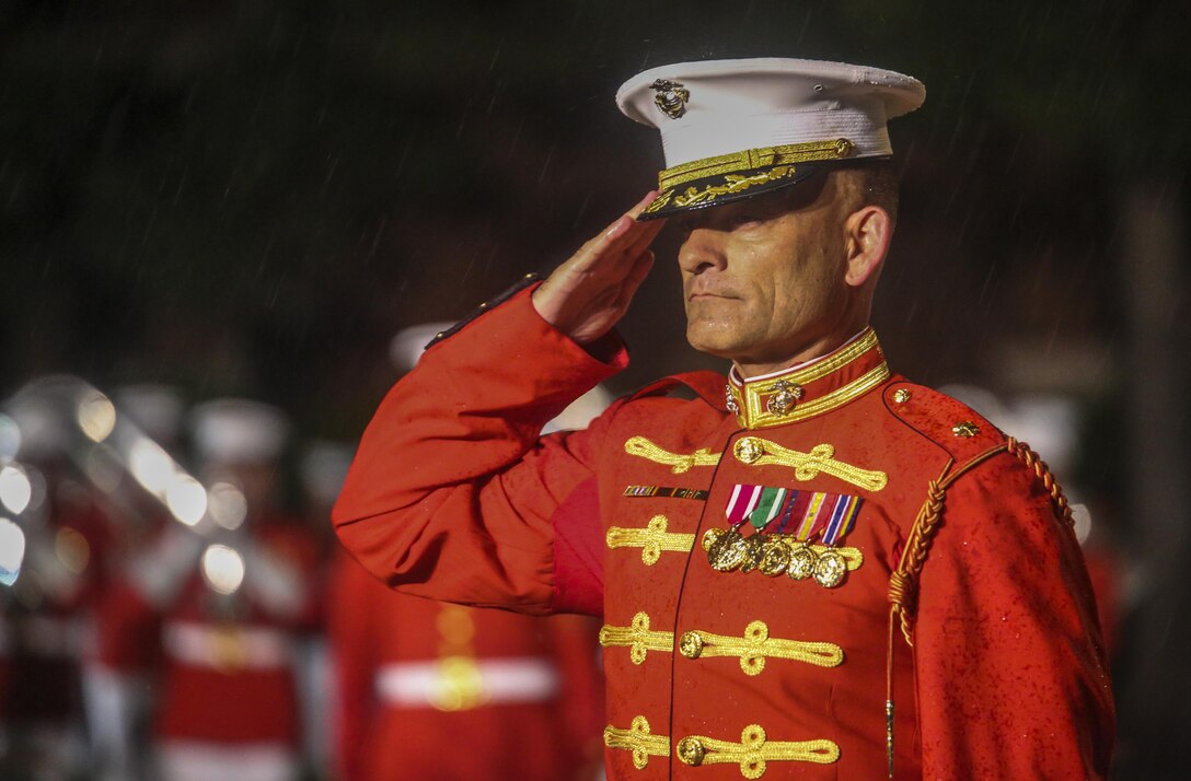 Major Christopher Hall, commanding officer, U.S. Marine Drum & Bugle Corps, salutes the parade commander during a Friday Evening Parade at Marine Barracks Washington D.C., May 5, 2017. The guests of honor for the parade were the Honorable Paul Cook, California’s 8th Congressional District Congressman, the Honorable Jack Bergman, Michigan’s 1st Congressional District Congressman, and the Honorable Salud Carbajal, California’s 24th Congressional District Congressman. The hosting official was Gen. Glenn Walters, assistant commandant of the Marine Corps.(Official Marine Corps photo by Lance Cpl. Damon Mclean/Released)