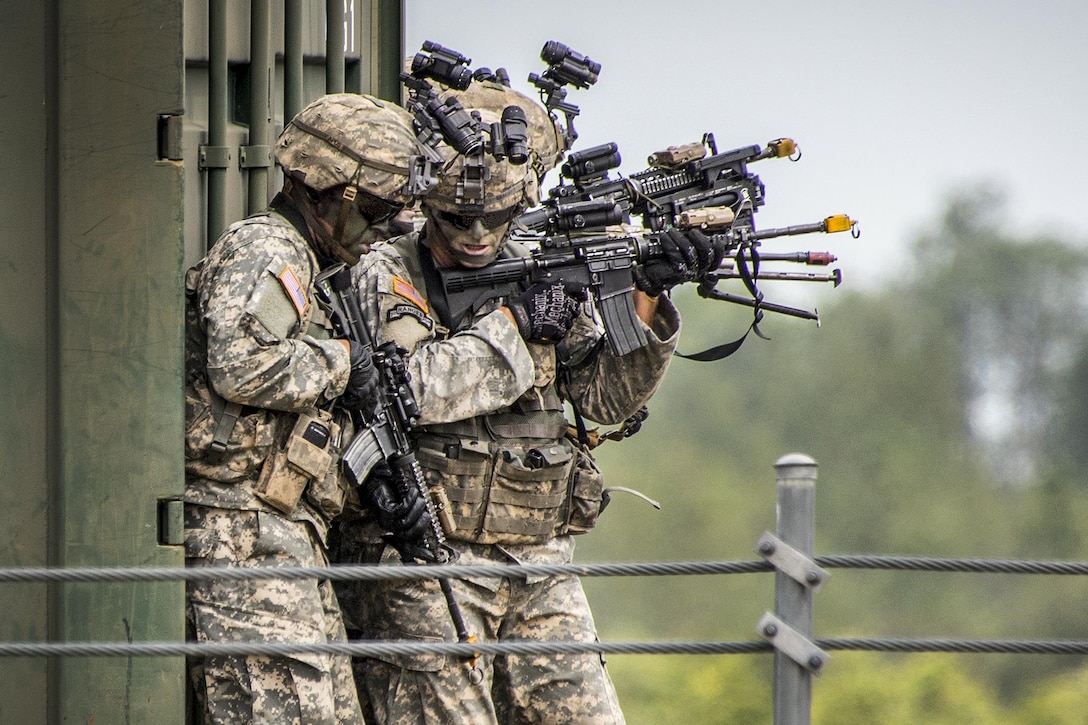 Army Rangers prepare to enter a building during a demonstration at the 6th Ranger Training Battalion’s open house at Eglin Air Force Base, Fla., April 29, 2017 The event showed hand-to-hand combat, a parachute jump, snake show and Rangers in action. Air Force photo by Samuel King Jr.