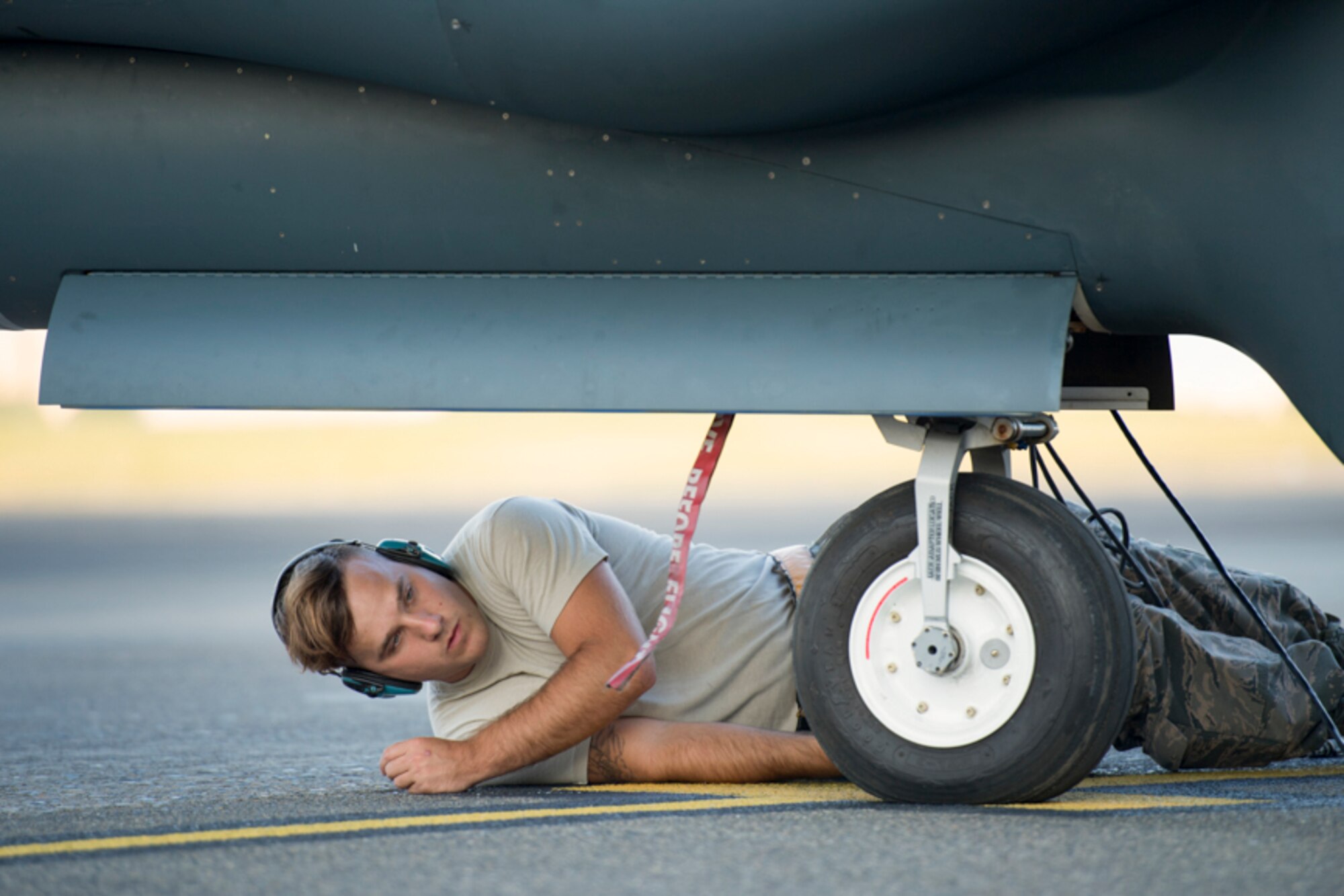 Senior Airman Vincent Lanzo, 69th Reconnaissance Group Detachment 1 avionics technician, performs a preflight inspection of an RQ-4 Global Hawk at Yokota Air Base, Japan, May 5, 2017. The Global Hawk's mission is to provide a broad spectrum of intelligence, surveillance, and reconnaissance collection capabilities to support combatant forces in worldwide peacetime, contingency and crisis operations. (U.S. Air Force photo by Yasuo Osakabe)