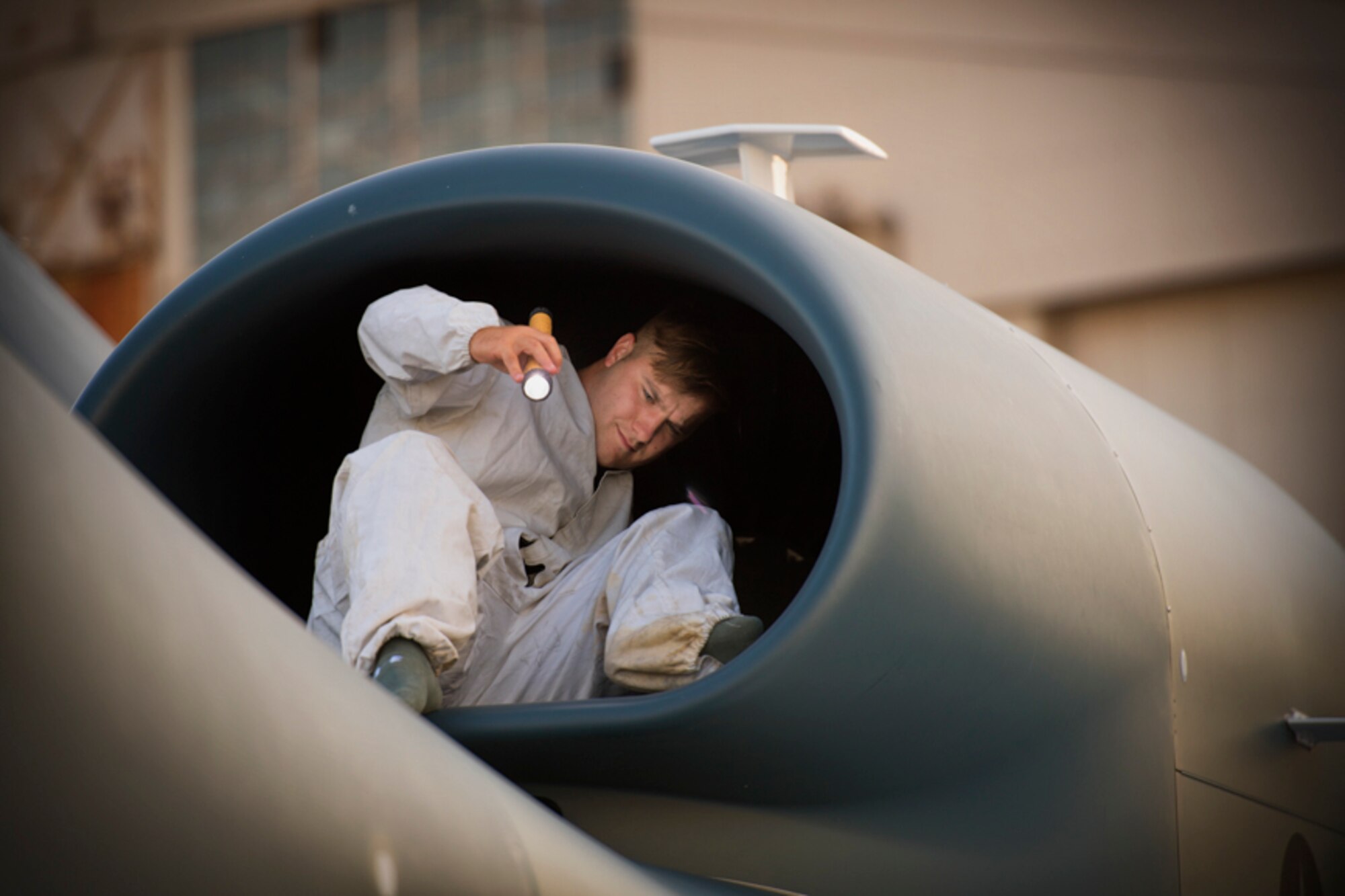 Senior Airman Vincent Lanzo, 69th Reconnaissance Group Detachment 1 avionics technician, completes inspection of the fan blades on an RQ-4 Global Hawk engine during a pre-flight inspection at Yokota Air Base, Japan.  The Global Hawk supports U.S. intelligence, surveillance, and reconnaissance priorities, operational plans, and contingency operations throughout the Pacific Theater. (U.S. Air Force photo by Yasuo Osakabe)