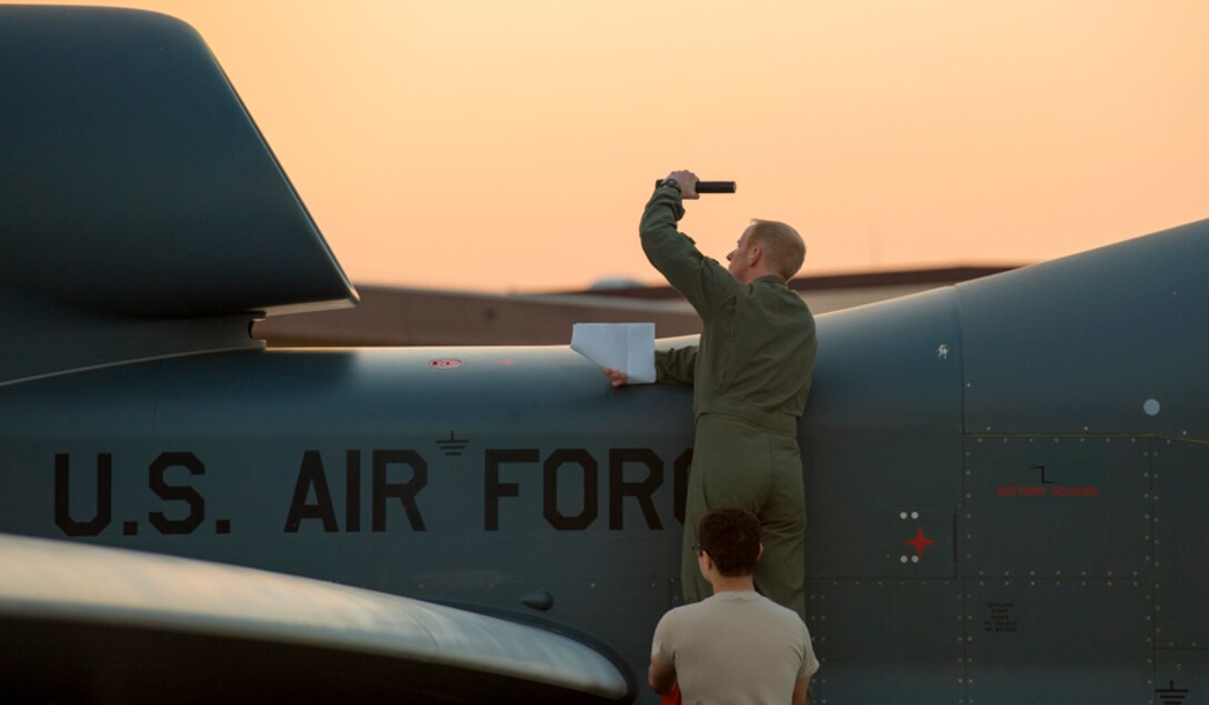 Capt. Mark, 69th Reconnaissance Group Detachment 1 RQ-4 pilot, inspects the fan blades on an RQ-4 Global Hawk at Yokota Air Base, Japan, May 5, 2017. Prior to its first take-off since arriving May 1. The Global Hawk's mission is to provide a broad spectrum of intelligence, surveillance, and reconnaissance collection capabilities to support combatant forces in worldwide peacetime, contingency and crisis operations. (U.S. Air Force photo by Yasuo Osakabe)