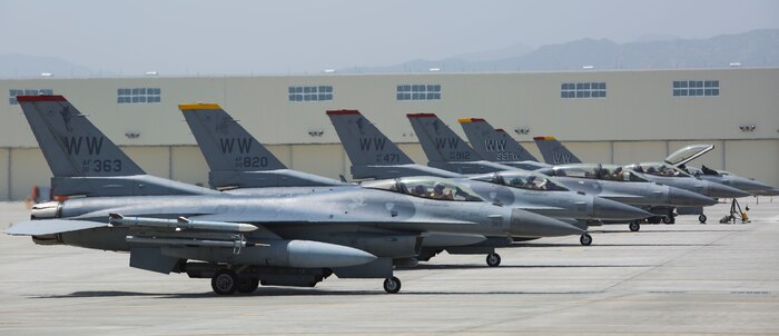 U.S. Air Force Senior Airman Charles Bolles, right, a crew chief with the 35th Aircraft Maintenance Unit from Misawa Air Base, and Masato Ohchi, hot pit operator at Marine Corps Air Station (MCAS) Iwakuni, conduct hot pit refueling on a U.S. Air Force F-16 Fighting Falcon at MCAS Iwakuni, Japan, May 8, 2017. Hot pits are refueling stations usually used in combat to rapidly refuel aircraft while the engines are running. This allows aircraft to return to the fight with minimal delay. (U.S. Marine Corps photo by Pfc. Stephen Campbell)