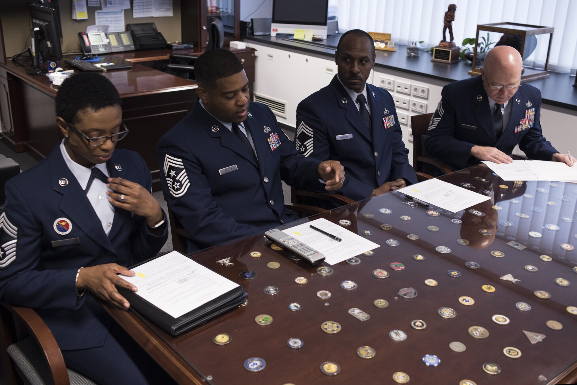 Chief Master Sergeant Phillip L. Easton, U.S. Air Forces in Europe and Air Forces Africa command chief master sergeant, (second from left) provides the rules of engagement to board members as he presides over the USAFE-AFAFRICA 12 Outstanding Airmen of the Year board, March 9, 2017, Ramtein Air Base, Germany. (U.S. Air Force Photo/Tech. Sgt. Micky M. Pena)