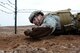 1st Lt. Jeffrey Davis, 435th Security Forces Squadron assistant operations officer, low-crawls while participating in the 435th CRG Olympics on Ramstein Air Base, Germany, May 5, 2017. The 435th Air Mobility Squadron, 435th Construction and Training Squadron, 435th Security Forces Squadron, and Detachment 1 each planned a competitive event to challenge the teams to not only complete, but to share with one another what each squadron in the 435th CRG does every day. (U.S. Air Force photo by Airman 1st Class Savannah L. Waters) 