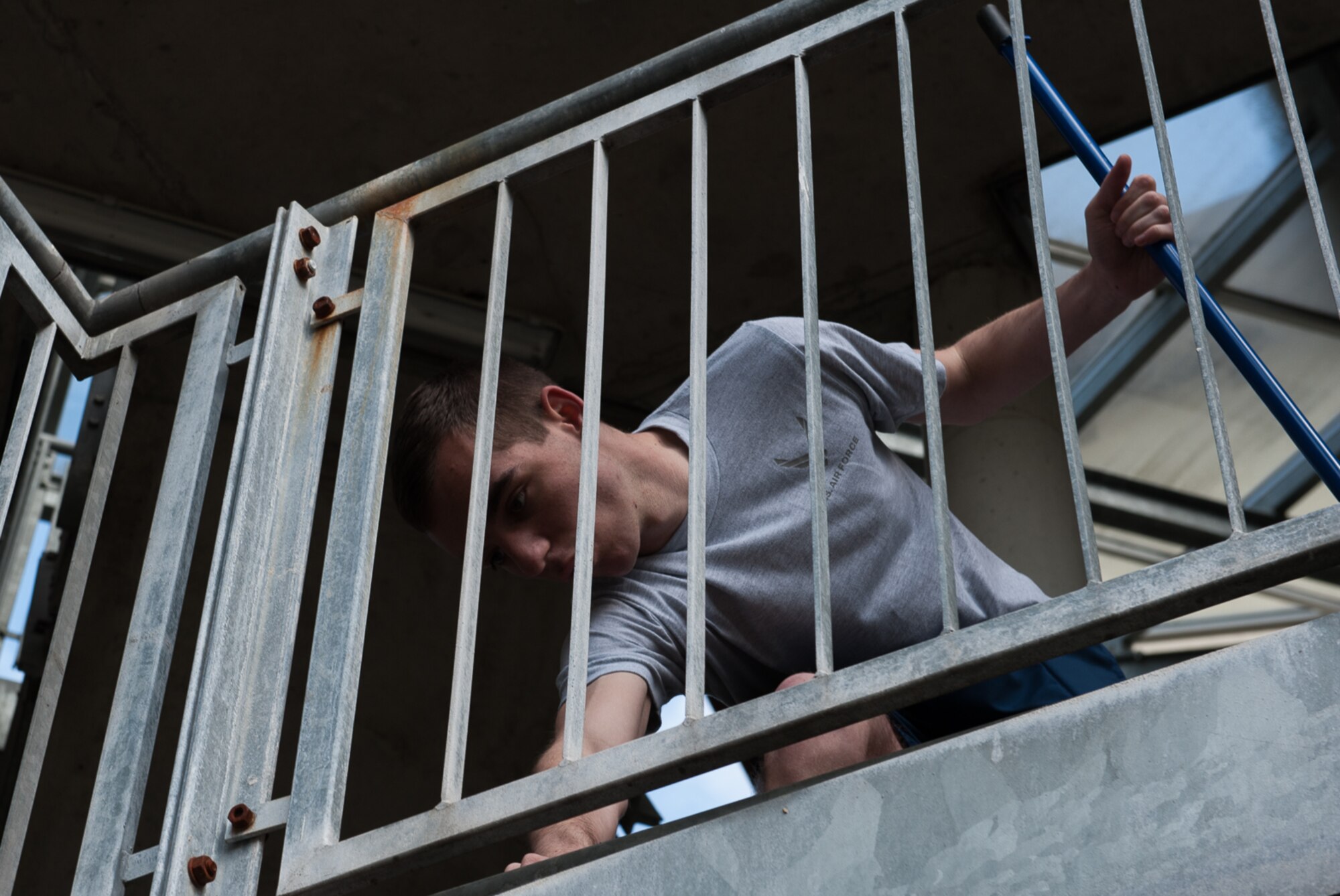 Airman 1st Class Hunter Jaques, 1st Air and Space Communications Operations Squadron cyber systems operator, cleans debris during ‘Clean Where You Live' on Ramstein Air Base, Germany, May 3, 2017. The 86th Airlift Wing, in coordination with U.S. Army Garrison Kaiserslautern, organized the spring cleanup event to help maintain clean living and work areas. (U.S. Air Force photo by Airman 1st Class Savannah L. Waters)