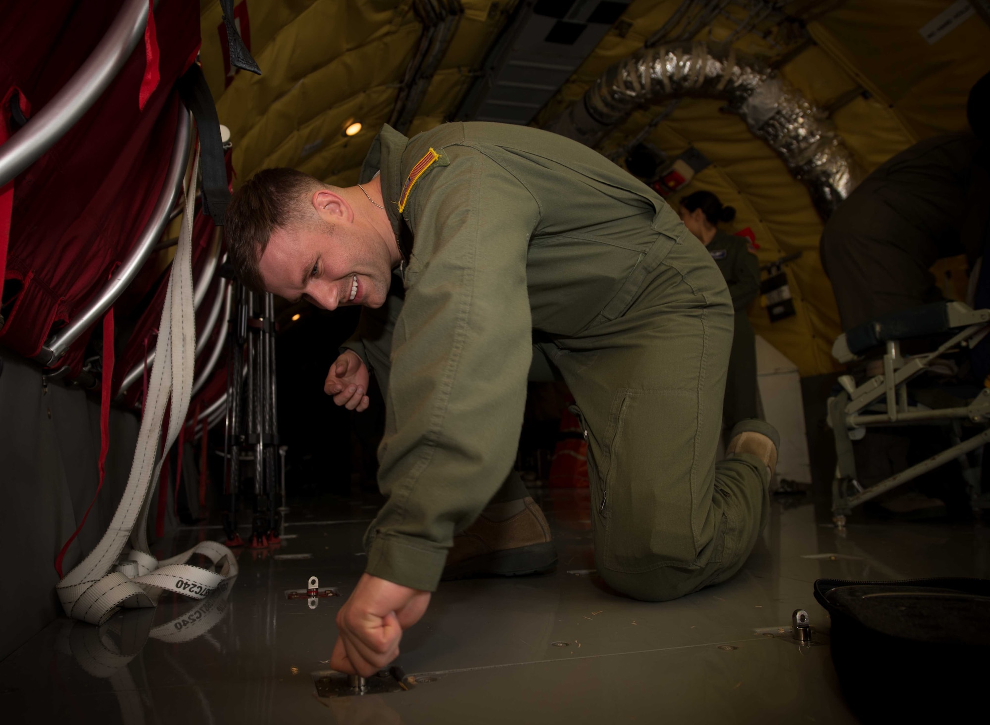 Staff Sgts. Dustin Alford, right, and Shaina Buller, 86th Aeromedical Evacuation Squadron technicians, prepare to board a KC-135 Stratotanker during a patient movement exercise on Ramstein Air Base, May 4, 2017. The 86th AES practiced transporting simulated patients on a KC-135 because most participants were relatively unfamiliar with the airframe. Practicing on unfamiliar airframes ensures that personnel are competent to transport patients no matter what airframe is available at the time. (U.S. Air Force photo by Senior Airman Elizabeth Baker/Released)