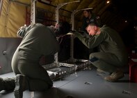 Capt. Jeana Angulo, left, 86th Aeromedical Evacuation Squadron flight nurse, and Maj Paul Devaughn, United States Air Forces Europe Patient Movement Requirements Center patient movement clinical coordinator, install a stanchion litter system in a KC-135 Stratotanker during a patient movement exercise on Ramstein Air Base, May 4, 2017. Members of the 86th AES are capable of transforming various airframes into secure patient transportation vessels any time they are called upon. (U.S. Air Force photo by Senior Airman Elizabeth Baker/Released)