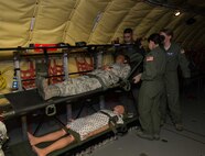 Members of the 86th Aeromedical Evacuation Squadron lift a simulated patient onto a stanchion litter system aboard a KC-135 Stratotanker during a patient movement exercise on Ramstein Air Base, May 4, 2017. Practicing patient evacuation in a realistic setting helps all involved personnel learn how to respond to unexpected complications that might occur in real-world scenarios, ensuring that they are experienced and prepared to hand real-world scenarios.  (U.S. Air Force photo by Senior Airman Elizabeth Baker/Released)