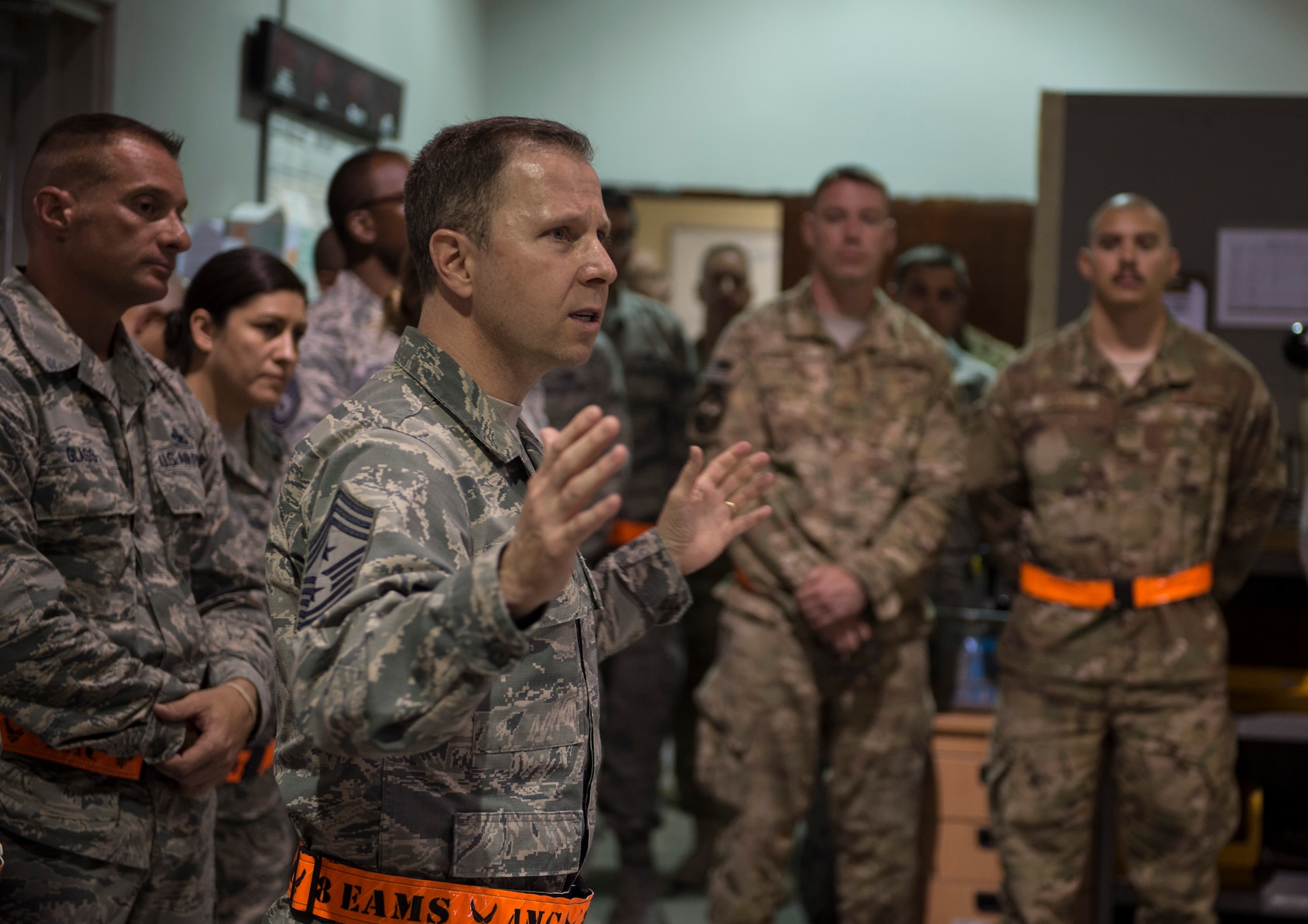 U.S. Air Force Chief Master Sgt. Mark Redden, Command Chief with the 521st Air Mobility Operations Wing at Ramstein Air Force Base, Germany, visits airmen with the 8th Expeditionary Air Mobility Squadron at Al Udeid Air Base, Qatar, May 6, 2017. Redden was accompanied by Chief Master Sgt. Shelina Frey, Command Chief Master Sergeant for Air Mobility Command and made several stops throughout the 8th Expeditionary Air Mobility Squadron sections, providing an opportunity for Airmen to speak about their duties and ask questions.  (U.S. Air Force photo by Tech. Sgt. Amy M. Lovgren)