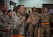 U.S. Air Force Chief Master Sgt. Mark Redden, Command Chief with the 521st Air Mobility Operations Wing at Ramstein Air Force Base, Germany, visits airmen with the 8th Expeditionary Air Mobility Squadron at Al Udeid Air Base, Qatar, May 6, 2017. Redden was accompanied by Chief Master Sgt. Shelina Frey, Command Chief Master Sergeant for Air Mobility Command and made several stops throughout the 8th Expeditionary Air Mobility Squadron sections, providing an opportunity for Airmen to speak about their duties and ask questions.  (U.S. Air Force photo by Tech. Sgt. Amy M. Lovgren)