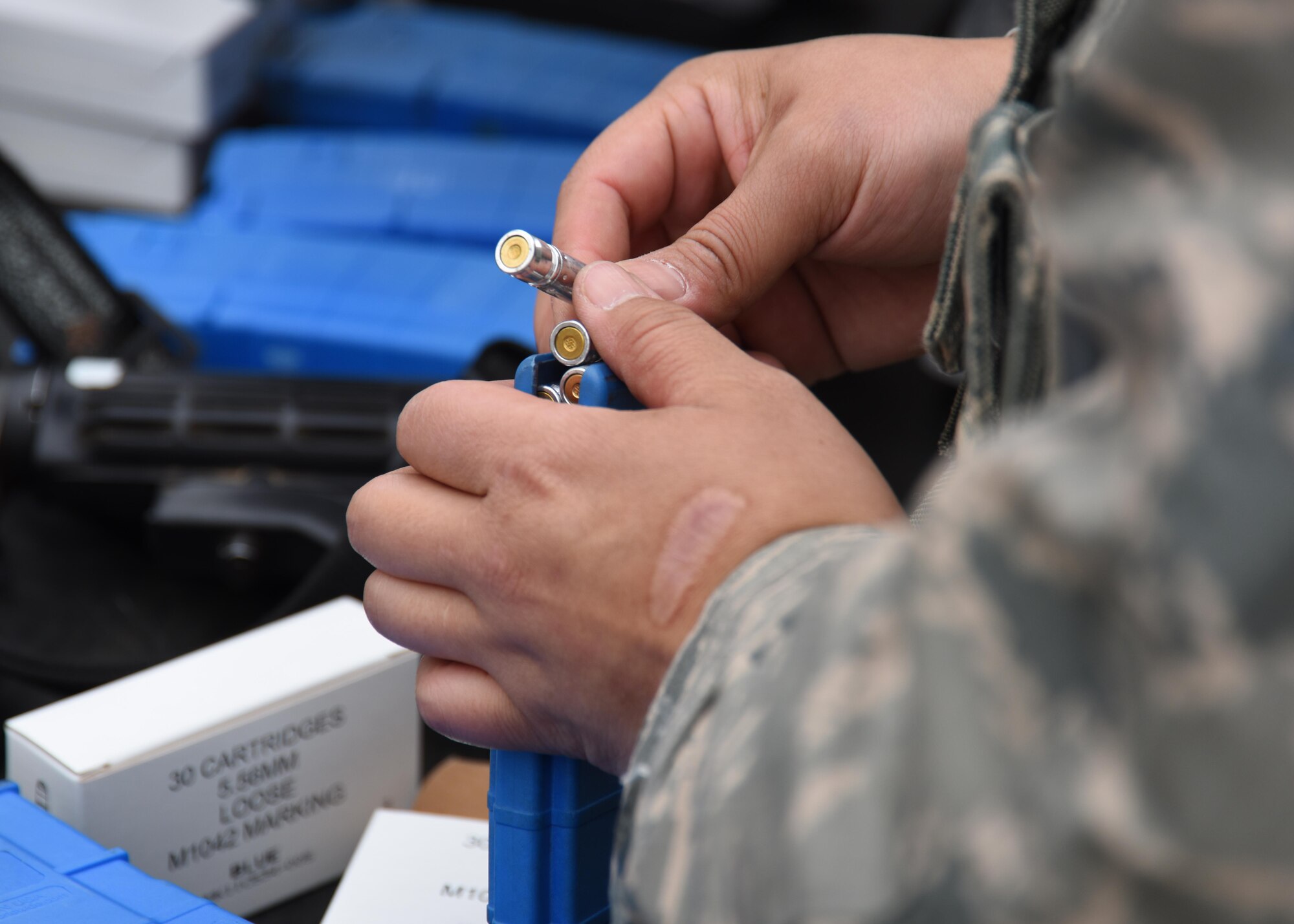 A 48th Security Forces Airman puts simulated munitions in a magazine during a training exercise at the Stanford Training Area, England, April 21. 48th SFS Airmen participated in a two-day volunteer training exercise to hone their skills in areas such as patrolling and clearing buildings. (U.S. Air Force photo/Airman 1st Class Abby L. Finkel)