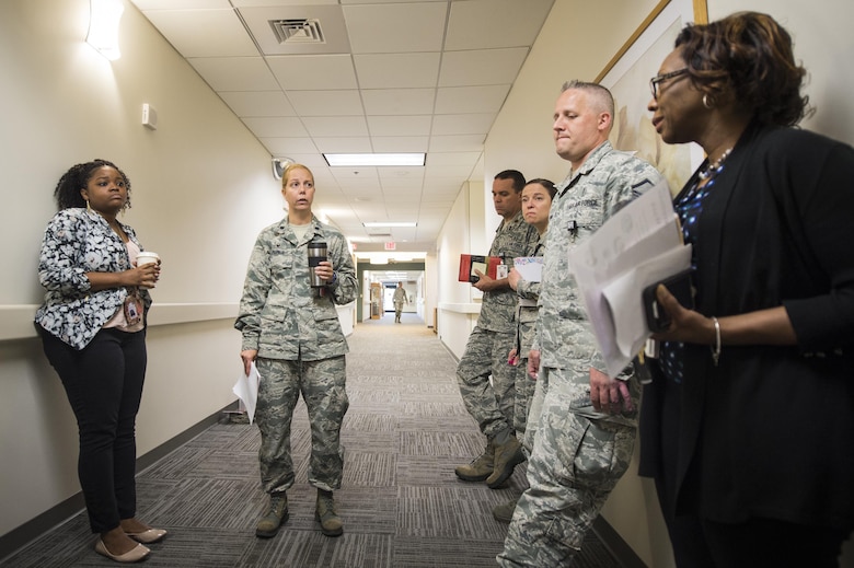 Lt. Col. Heather Perez, 23d Medical Operation Support Squadron commander and chief of nursing, conducts a morning huddle with her medical team, May 2, 2017, at Moody Air Force Base, Ga. As Moody's chief nurse, Perez is in charge of approximately 300 nurses and medical technicians. She uses her vast nursing experiences to improve medical processes, ensure patient safety, and manage education and training. (U.S. Air Force photo by Senior Airman Ceaira Young)