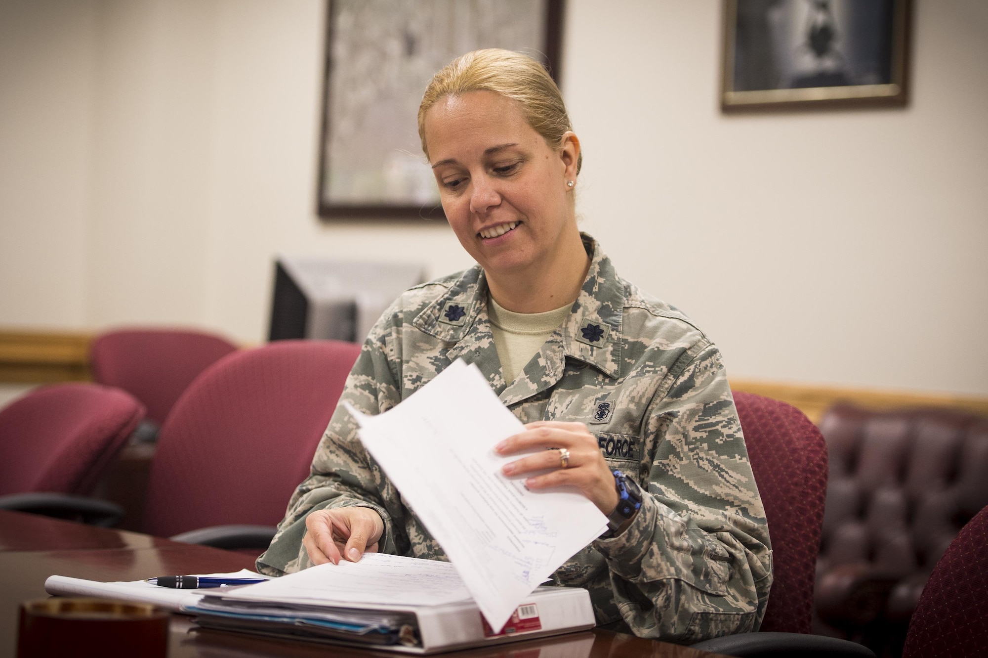 Lt. Col. Heather Perez, 23d Medical Operation Support Squadron commander and chief of nursing, smiles during a meeting, May 2, 2017, at Moody Air Force Base, Ga. As Moody's chief nurse, Perez is in charge of approximately 300 nurses and medical technicians. She uses her vast nursing experiences to improve medical processes, ensure patient safety, and manage education and training. (U.S. Air Force photo by Senior Airman Ceaira Young)