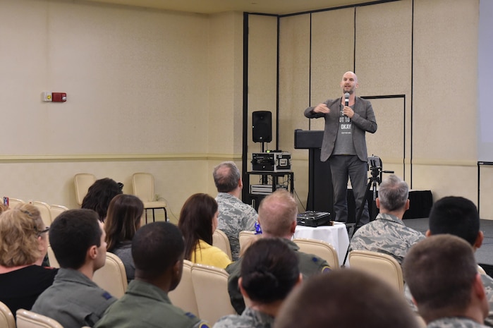Leon Logothetis, Kindness Diaries author, addresses the audience during a base visit May 4, 2017, at Joint Base Charleston, S.C. Logothetis spoke about the importance of kindness and helping others during his presentation.