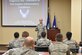 Col. Chol Chong, 59th Dental Training Squadron Periodontics Residency Program director, speaks to an audience during a continuing education dental conference at Joint Base Charleston, S.C., May 5, 2017. Chong discussed the diagnosis and treatment procedures of peri-implant inflammatory conditions. The conference served as a forum to discuss growing trends and the way ahead for the Air Force dental community. Topics focused primarily on dental implants and procedures for treating potential complications that may arise after a procedure.