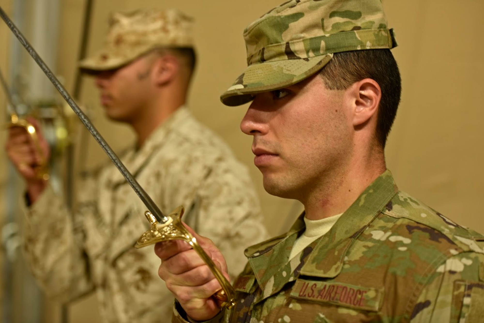 U.S. Air Force Senior Airman Jose Cobo Bernal, 407th Expeditionary Logistic Readiness Squadron materiel management technician, practices sword drill during a U.S. Marine Corps Corporal’s Course May 2, 2017. The corporal’s course is a 14-day formal training event designed to educate Marine corporals on the duties and responsibilities of an NCO. Deployed Airmen were granted the opportunity to attend the course, which is an eligibility requirement for Marines before promoting to the rank of sergeant. (U.S. Air Force photo by Senior Airman Ramon A. Adelan) 