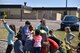 Children from the Malmstrom Youth Center place pinwheels around fences to help raise awareness on child abuse prevention April 13, 2017. National Provider Appreciation Day May 12 recognizes the impact child care providers have on the community. (U.S. Air Force photo/Master Sgt. Chad Thompson) 