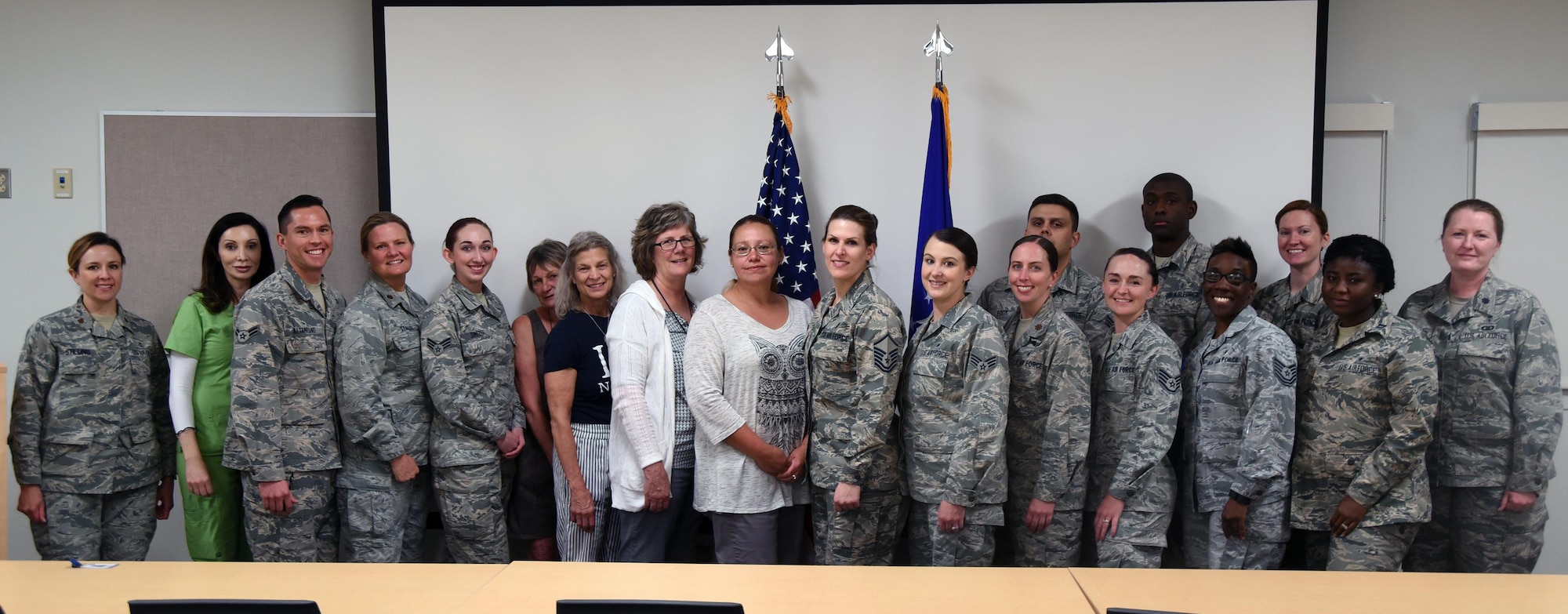 Some of the 377th Medical Group's nurses and technicians pose for a photo following a proclamation signing for National Nurses and Medical Technicians Week. The week honors nurses and technicians for their contributions to world-class healthcare. 