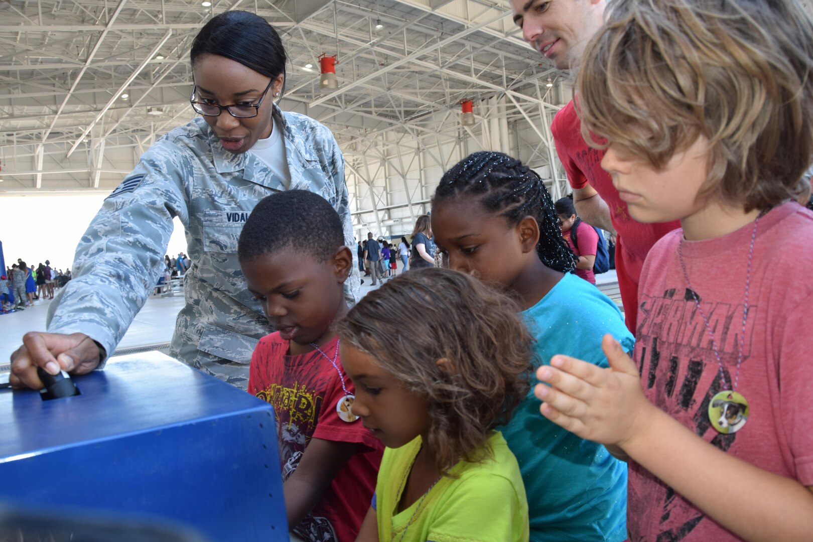 Staff Sgt. Cristiana Vidal, a 433rd Medical Squadron medical technician, teaches children about the proper methods to clean their hands at the 433rd Airlift Wing Family Day May 7, 2017 at Joint Base San Antonio-Lackland, Texas. Airmen also taught children about CPR, substance abuse and dental hygiene. (U.S. Air Force photo by Tech. Sgt. Carlos J. Trevino)