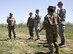 Staff Sgt. Makayla McConnell, 114th Security Forces Squadron security response team member, instructs her fellow Airmen on proper tactical squad movements May 6, 2017, on a training site near Sioux Falls S.D. McConnell is the first female from the 114th Security Forces Squadron to attend and complete Combat Leadership School. (U.S. Air National Guard photo by Staff Sgt. Duane Duimstra/Released)