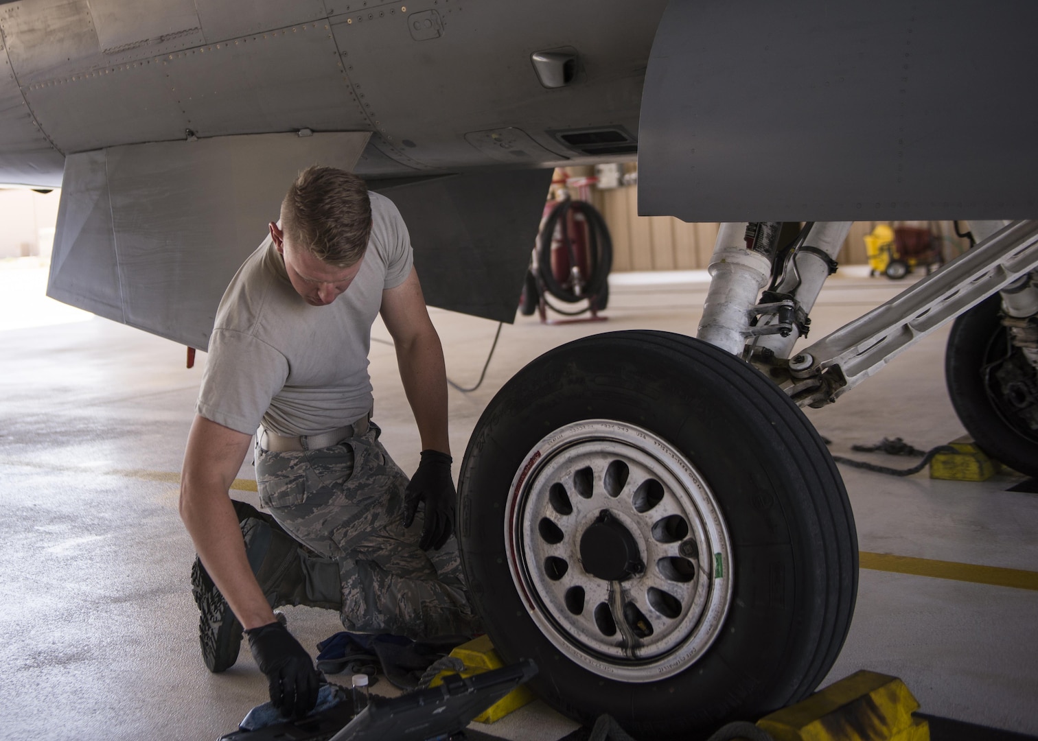 Airman 1st Class Derek King, a 54th Aircraft Maintenance Unit F-16 crew chief, performs maintenance on an F-16 Fighting Falcon at Holloman Air Force Base, N.M. on May 3, 2017. The 54th AMU runs 24 hour operations. Therefore, Holloman’s maintenance Airmen work round-the-clock to keep these aircraft operable and flying. (U.S. Air Force photo by Airman 1st Class Alexis P. Docherty)