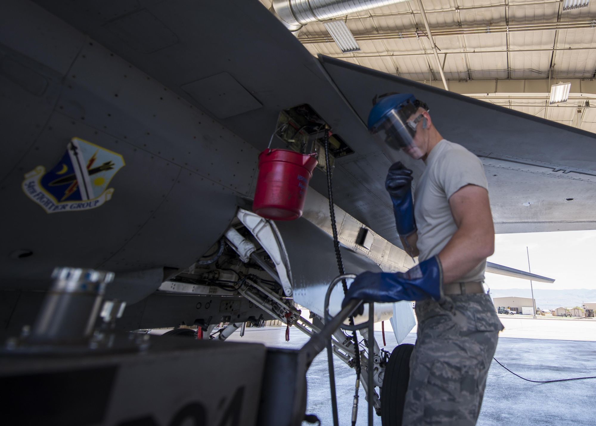 Airman 1st Class Derek King, a 54th Aircraft Maintenance Unit F-16 crew chief, performs recovery operations on an F-16 Fighting Falcon at Holloman Air Force Base, N.M. on May 4, 2017. Crew chiefs perform a variety of maintenance tasks from oil servicing and tire checks to readying a jet for flight. (U.S. Air Force photo by Airman 1st Class Alexis P. Docherty) 