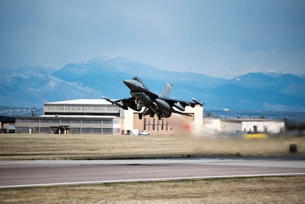 An F-16 Fighting Falcon aircraft from the 120th Fighter Squadron, 140th Wing, takes off at Buckley Air Force Base, Colorado on its way to Kadena Air Base, Japan for a deployment in support of the Theater Security Package.