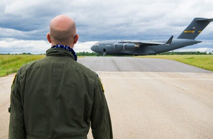 Leon Logothetis, TV personality and author of The Kindness Diaries, walks toward a C-17 Globemaster III during his visit to Joint Base Charleston, S.C., May 5, 2017. Logothetis flew with the 14th Airlift Squadron to receive a firsthand look at the mission of the 437th Airlift Wing and Air Mobility Command. Logothetis said he was impressed with the Air Force’s capabilities during his visit.