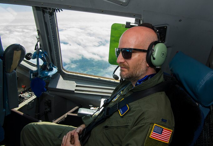 Leon Logothetis, TV personality and author of The Kindness Diaries, rides in the cockpit of a C-17 Globemaster III during his visit to Joint Base Charleston, S.C., May 5, 2017. Logothetis flew with the 14th Airlift Squadron to receive a firsthand look at the mission of the 437th Airlift Wing and Air Mobility Command.
