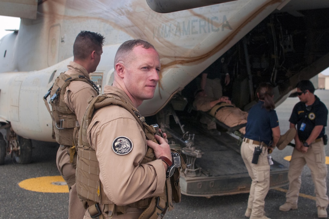 U.S. Marine Corps Capt. Nathan Frame, a MV-22 Osprey Pilot with Marine Medium Tiltrotor Squadron - 364 (VMM-364), supervises casualty loading and off-loading procedures during a joint training exercise with Combat Medics, from the 86th Combat Support Hospital, and Emergency Medical Technicians from Area Support Group - Kuwait, Joint Emergency Services, at Camp Arifjan, Kuwait, May 8, 2017. 
(U.S. Army Photo by Sgt. Christopher Bigelow)