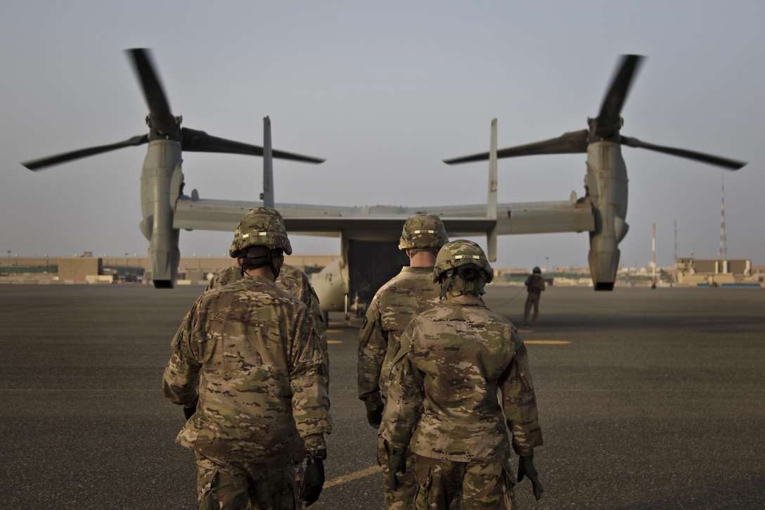 U.S. Army combat medics, with the 86th Combat Support Hospital, approach a MV-22 Osprey during a joint training exercise with Marines from Marine Medium Tiltrotor Squadron - 364 (VMM-364), at Camp Arifjan, Kuwait, May 8, 2017. (U.S. Army photo by Staff Sgt. Dalton Smith)