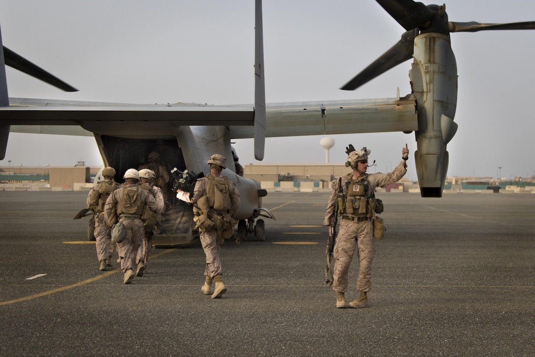 U.S. Marines ingress on to a MV-22 Osprey after a joint training exercise with Marines from Marine Medium Tiltrotor Squadron - 364 (VMM-364) and U.S. Army combat medics, with the 86th Combat Support Hospital, at Camp Arifjan, Kuwait, May 8, 2017. (U.S. Army photo by Staff Sgt. Dalton Smith)