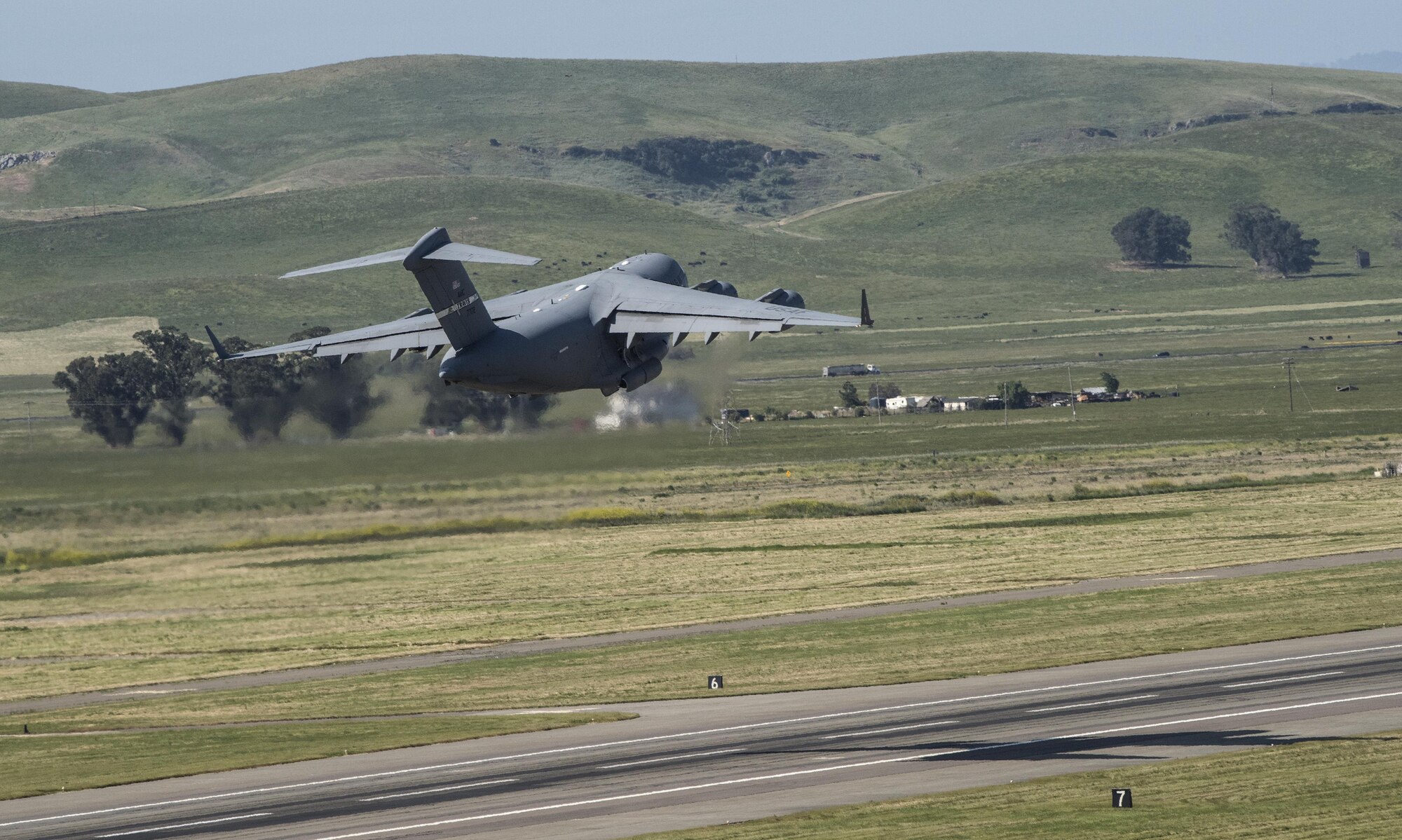 A C-17 Globemaster III takes off from Travis Air Force Base, Calif., during the Wings Over Solano Air Show May 6, 2017. The two-day event featured performances by the U.S. Army Golden Knights parachute team, U.S. Air Force Thunderbirds, flyovers and static displays. (U.S. Air Force photo by Heide Couch)