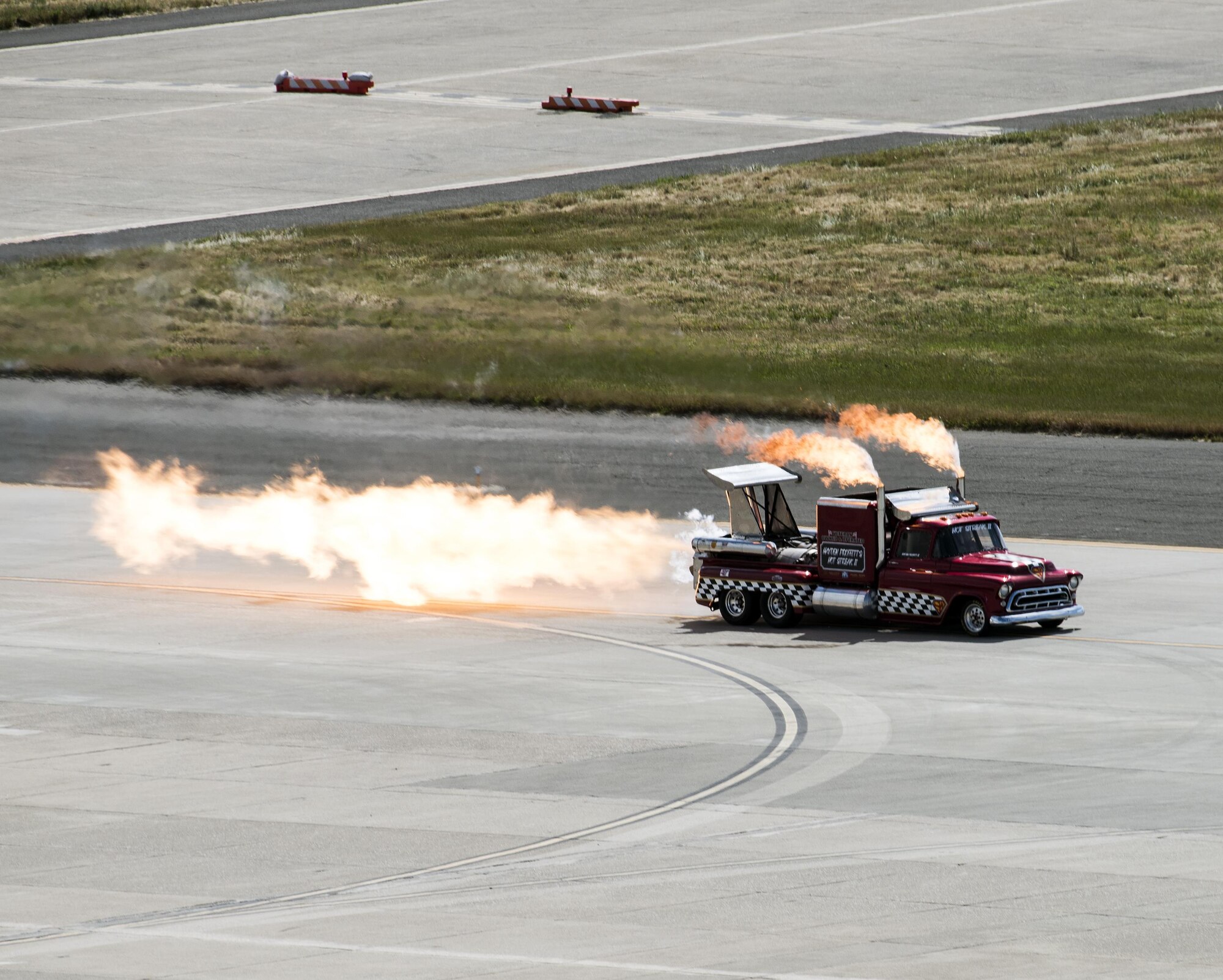 The Smoke and Thunder Jet Truck peforms at the Wings Over Solano Air Show at Travis Air Force Base, Calif., May 6, 2017. The two day event featured performances by the U.S. Air Force Thunderbirds aerial demonstration team, U.S. Army Golden Knights parachute team, flyovers and static displays. 
(U.S. Air Force photo by David Cushman)