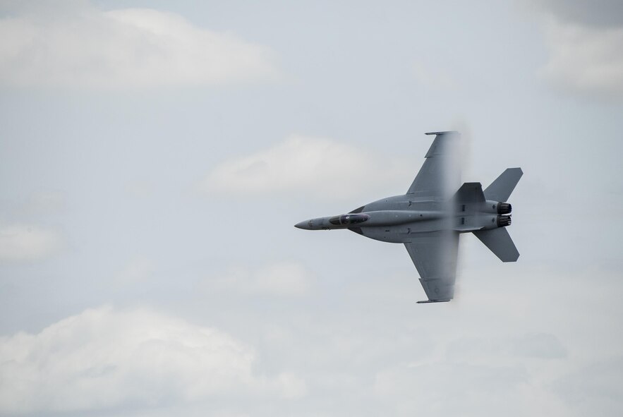 An F-18 Hornet soars high above Travis Air Force Base, Calif., during the Wings over Solano Air Show May 6, 2017. The two-day event also featured performances by the U.S. Army Golden Knights parachute team, flyovers and static displays. (U.S. Air Force photo by Heide Couch)