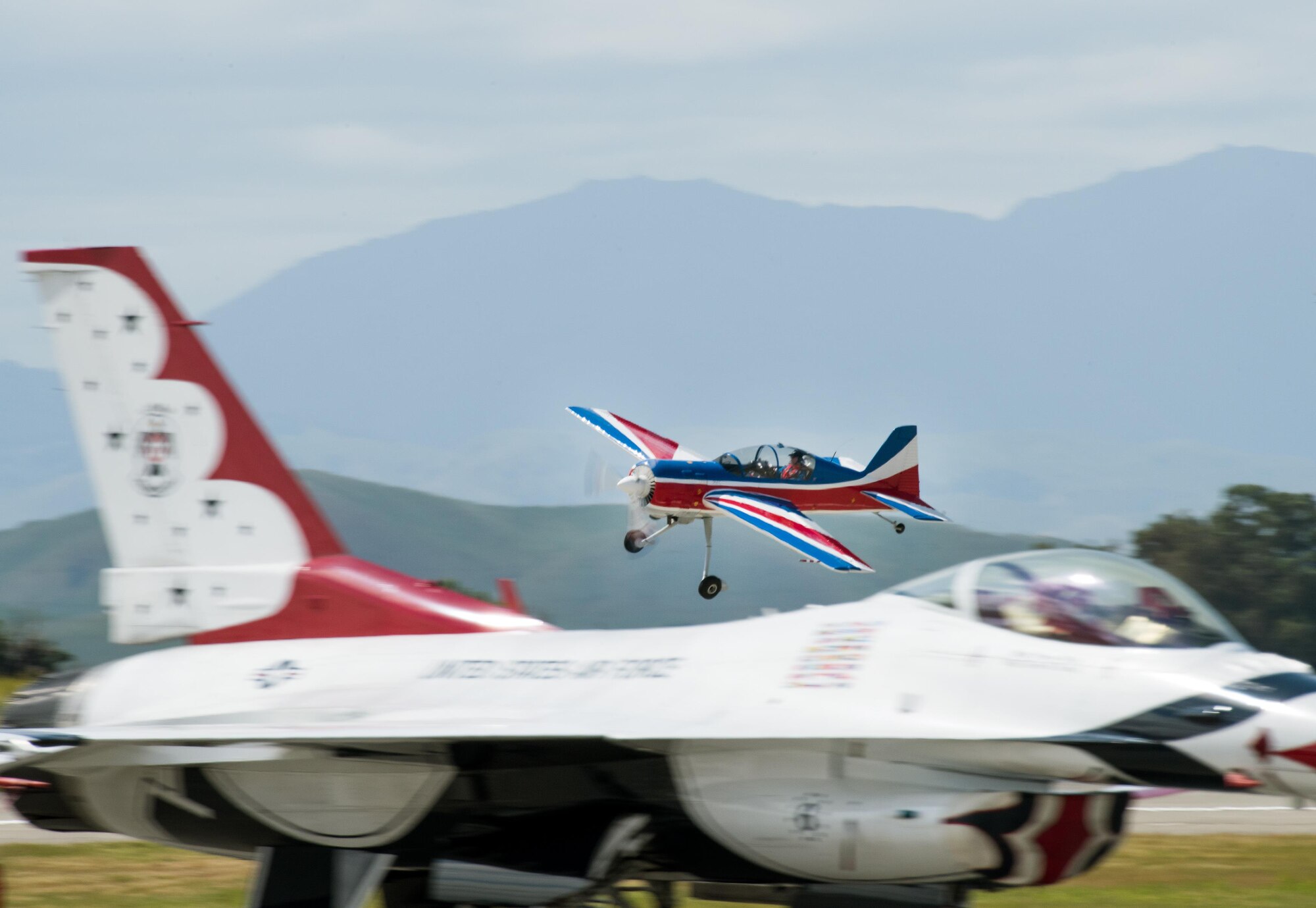 Rich Perkins flys a Russian Thunder YAK-54 during the Wings Over Solano Air Show at Travis Air Force Base, Calif., May 6, 2017. The two-day event featured performances by the United States Air Force Thunderbirds aerial demonstration team, flyovers and static displays. (U.S. Air Force photo by Louis Briscese)