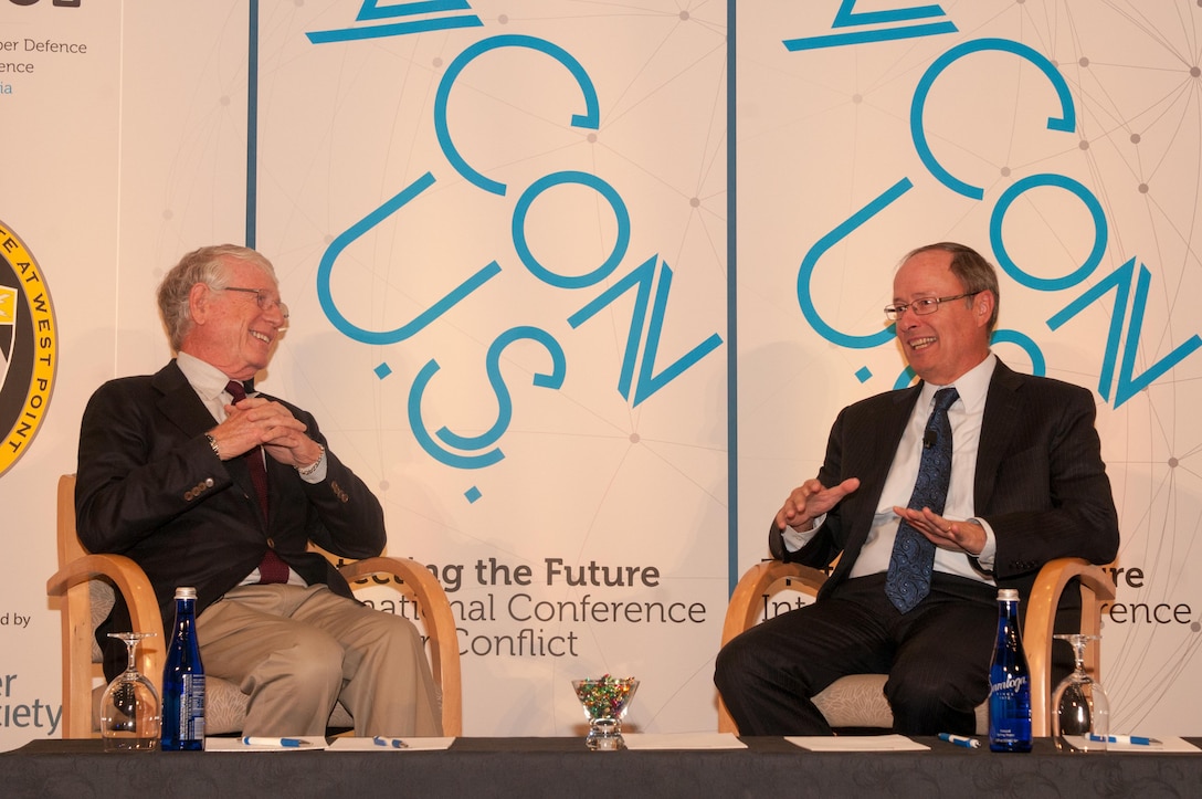 Ted Koppel (left), former Nightline Anchor, and Gen. (Ret.) Keith Alexander (right), CEO and president of IronNet Cybersecurity and former Director of the National Security Agency, discuss precautions that need to be taken to prevent a potential cyber attack equivalent to the Pearl Harbor attack at the U.S. International Conference on Cyber Conflict in Washington D.C., Oct. 22, 2016. The conference aims to facilitate information exchange among industry, academia and government entities. #CyConUS16 (U.S. Army photo by Sgt. David N. Beckstrom, 5th Mobile Public Affairs Detachment, I Corps)