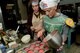 U.S. Air Force Capt. Amanda Pelkowski, left, and Tech. Sgt. Ashley Long, “Princess Lea’s Cinnamon Rolls” team members, distribute cake batter into cupcake liners at Shaw Air Force Base, S.C., May 4, 2017. Four teams of three people competed in a bake-off during the 2017 Cupcake Wars. (U.S. Air Force photo by Airman 1st Class Destinee Sweeney)