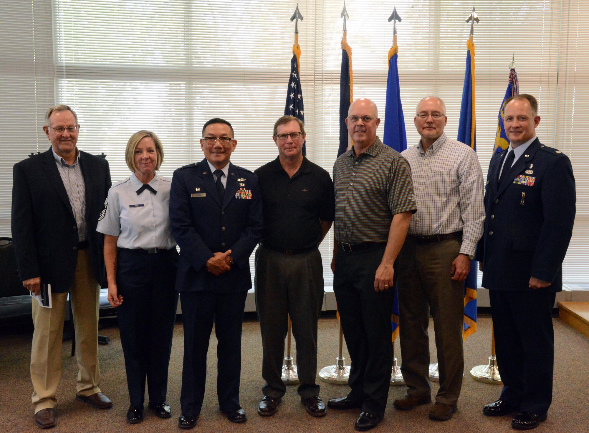 Retired Chief Master Sgt. Mike Handsacker, Chief Master Sgt. Kris A. Rode, Col. Jim P. Duong, retired Col. Raymond Webster, retired Col. James Bartlett, retired Col. Michael Peters and Lt. Col. Chad M. Hynnek of the 132d Wing Medical Group pose for a photo after the change of command ceremony at the 132 WG MDG, Des Moines, Iowa on May 7, 2017. This ceremony formally recognized Hynnek accepting the MDG commander role. (U.S. Air National Guard photo by Airman 1st Class Katelyn Sprott)