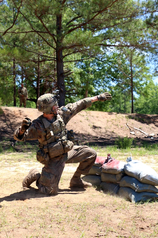 Army Pfc. Matthew Bates, a cavalry scout with the 3rd Infantry Division's squad at the Gainey Cup competition, prepares to throw a training grenade during a squad exercise at Fort Benning, Ga., May 3, 2017.Army photo by Staff Sgt. Candace Mundt
