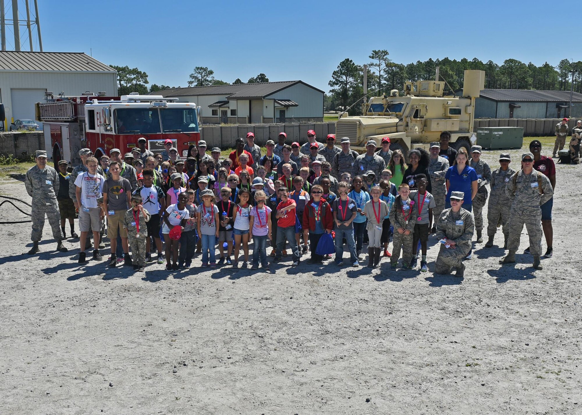 Tyndall Jr. Raptor participants and volunteers pose for a group photo at the Tyndall Air Force Base, Fla., Silver Flag site May 6, 2017. The annual Jr. Raptor program benefits military children by providing educational and hands-on activities on what their parents do to support the Tyndall mission. (U.S. Air Force photo by Senior Airman Sergio A. Gamboa/Released)