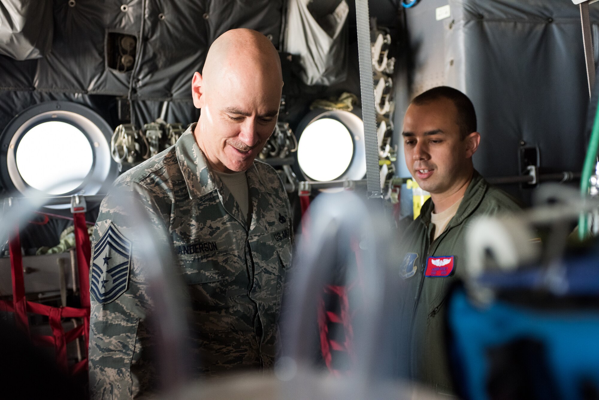 Chief Master Sgt. Ronald C. Anderson, command chief master sergeant of the Air National Guard, asks Staff Sgt. Aaron Rickey, a 137th Aeromedical Evacuation Squadron flight instructor, about equipment used by AES Airmen during a tour of the 137th Special Operations Wing at Will Rogers Air National Guard Base in Oklahoma City, May 8, 2017. The tour allowed Lt. Gen. L. Scott Rice, the director of the Air National Guard, and several other distinguished visitors to not only get a look into the special operations mission of the 137 SOW but also find ways to better serve the Airmen of the Air National Guard. (U.S. Air Force photo by Staff Sgt. Kasey Phipps)