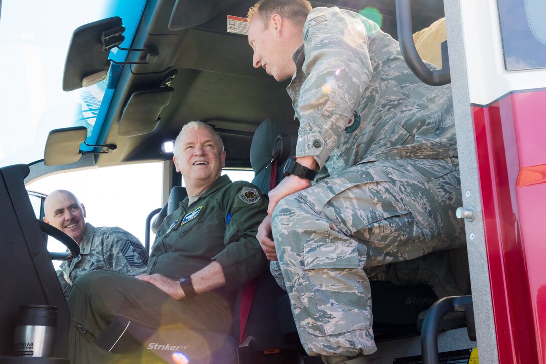 Staff Sgt. Eddie Myers, 137th Fire Department airman, demonstrates the capabilites of the department's Oshkosh Striker aircraft rescue and firefighting vehicle to Lt. Gen. L. Scott Rice, director of the Air National Guard, and Chief Master Sgt. Ronald C. Anderson, command chief master sergeant of the Air National Guard, during a tour of the 137th Special Operations Wing at Will Rogers Air National Guard Base in Oklahoma City, May 7, 2017. The tour allowed the director and several other distinguished visitors to not only get a look into the special operations mission of the 137 SOW but also find ways to better serve the Airmen of the Air National Guard. (U.S. Air Force photo by Staff Sgt. Kasey Phipps)