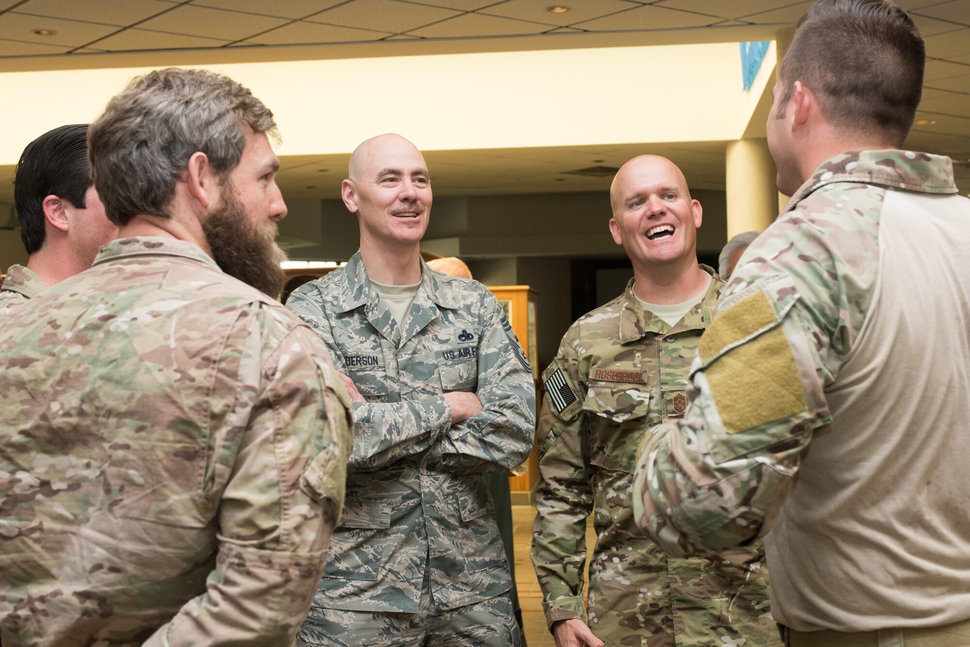 Chief Master Sgt. Ronald C. Anderson, command chief master sergeant of the Air National Guard, and Chief Master Sgt. Stephen L. Rosebrook, command chief master sergeant of the 137th Special Operations Wing, speak with Airmen from the Air Support Element, 137 SOW, during a tour of the 137th Special Operations Wing at Will Rogers Air National Guard Base in Oklahoma City, May 8, 2017. The tour allowed the director and several other distinguished visitors to not only get a look into the special operations mission of the 137 SOW but also find ways to better serve the Airmen of the Air National Guard. (U.S. Air Force photo by Staff Sgt. Kasey Phipps)