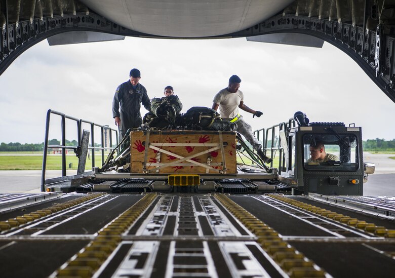 Loadmasters from the 14th Airlift Squadron load cargo into the bay of a C-17 Globemaster III during a training exercise at Joint Base Charleston, S.C., May 5, 2017. The 14th Airlift Squadron, 437th Airlift Wing, provides combat-ready aircrews for worldwide, direct-delivery airlift supporting rapid global mobility efforts of the Air Force.