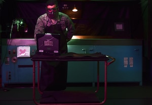 U.S. Air Force Airman 1st Class Dylan Snoddy, 1st Maintenance Squadron non-destructive inspection technician, looks up technical orders for using the magnetic particle unit at Joint Base Langley-Eustis, Va., May 9, 2017. The magnetic particle unit is used to detect faults in ferromagnetic parts that could result in hazards and equipment malfunctions. (U.S. Air Force photo/Staff Sgt. Natasha Stannard)