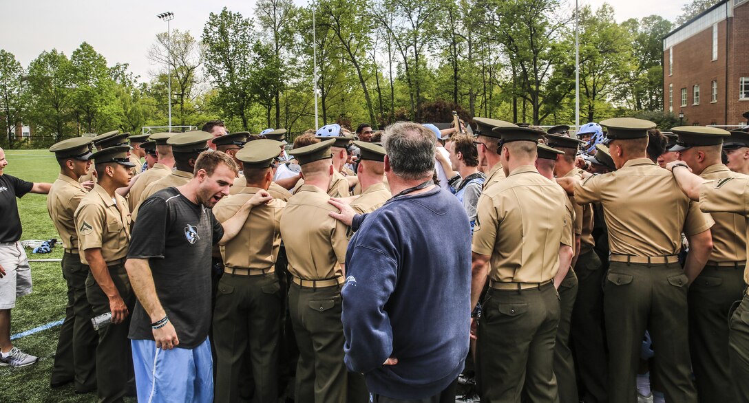 Marines with first platoon, Guard Company, Marine Barracks Washington D.C., executed a "surprise" training regimen at Johns Hopkins University, April 27, 2017. The training promotes team leadership, unit cohesion, and physical endurance. The regimen, designed and executed by the university's Head Strength and Conditioning Coach, Jay Dyer, consists of challenging workouts designed to condition Division One athletes prior to NCAA playoffs and national championships. Upon completion, the Marines were invited to tour the Johns Hopkins Lacrosse facilities in addition to watching the Varsity Men's Lacrosse practice. (Official Marine Corps photo by Lance Cpl. Damon Mclean/Released)